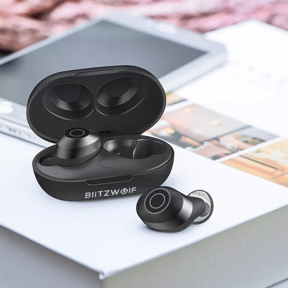 Black wireless earbuds with charging case on a surface