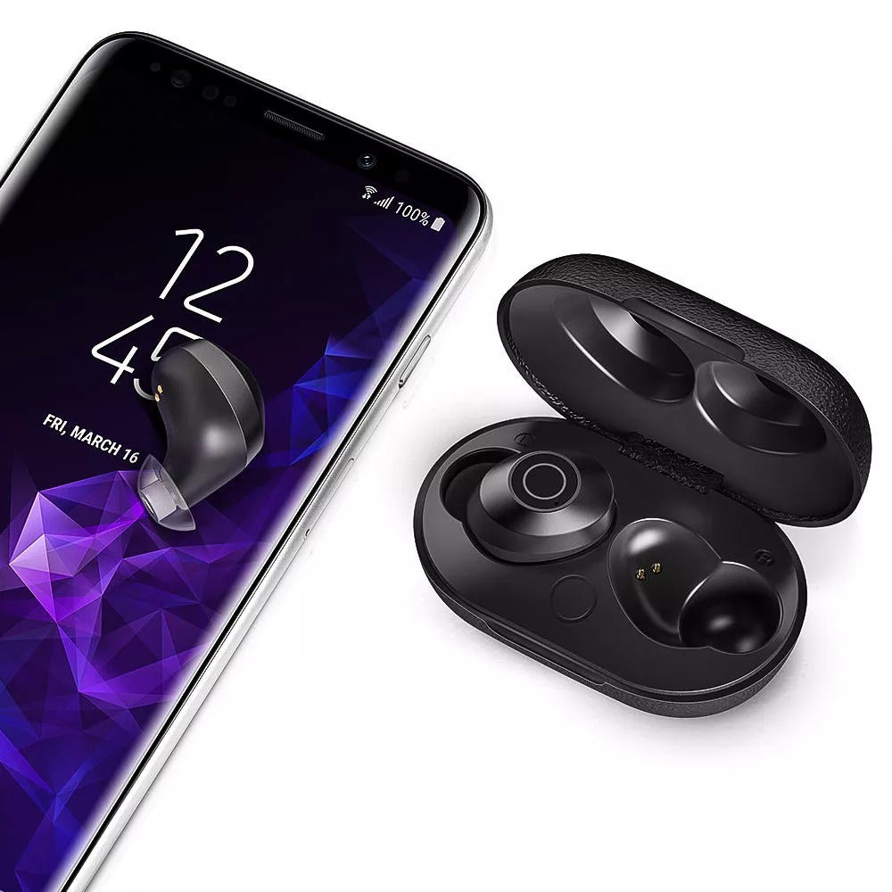 Black wireless earbuds with charging case next to a smartphone on a white background